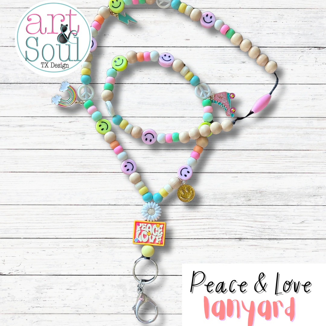 A full view of the Peace and Love lanyard.  All the roller skate and rainbow charms can be seen.