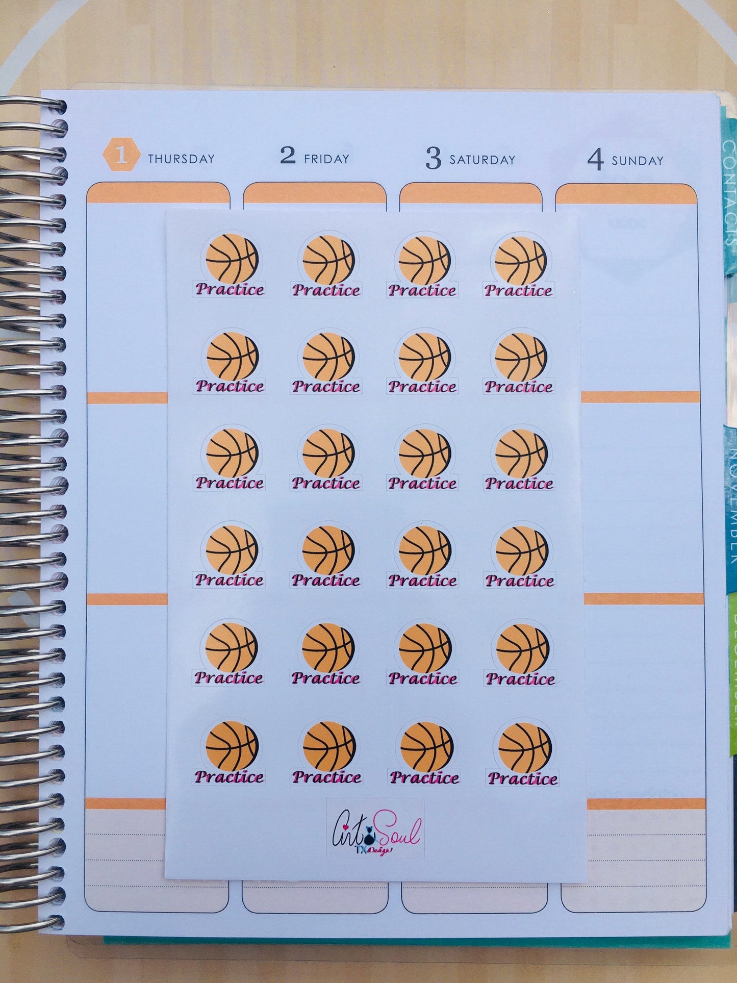 A Basketball Practice sticker sheet on top of an open Erin Condren life planner.