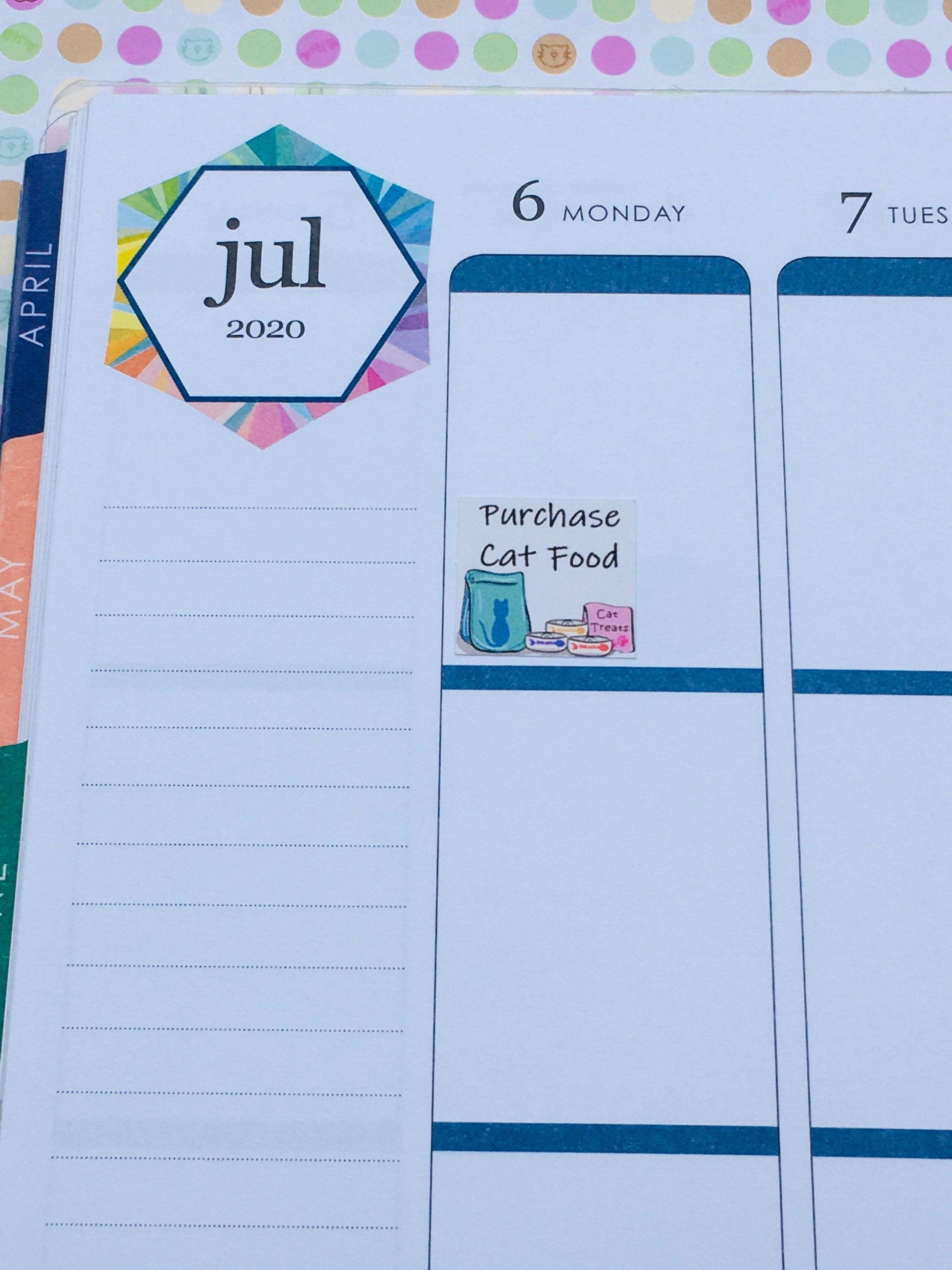 The Purchase Cat Food Planner Sticker on on daily page in a planner.